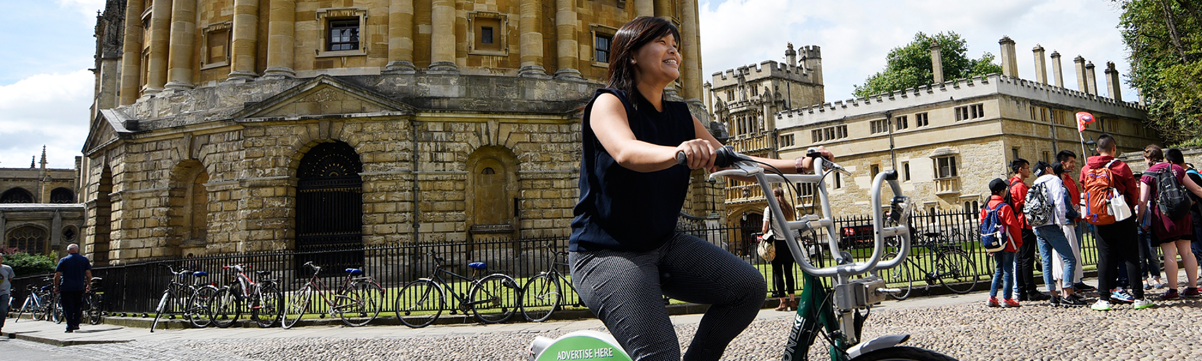 Image of cyclist riding around the Radcliffe camera